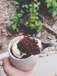 Close-up of hand holding ice cream