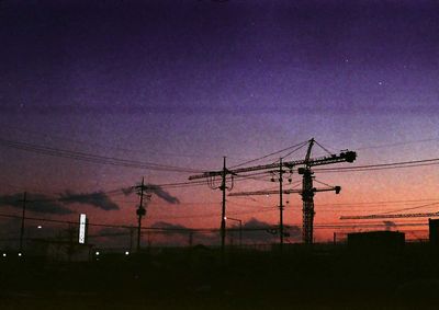 Low angle view of electricity pylon against sky