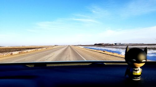 Close-up of road against sky