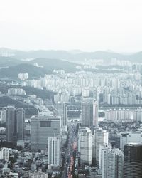 High angle view of buildings in city against clear sky