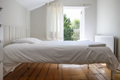 White curtain on bed at home