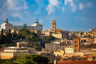 Buildings in city against sky