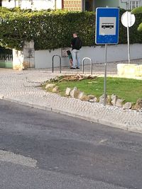 Man crossing road sign