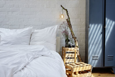 White wicker basket on bed at home