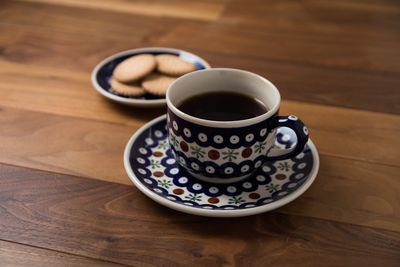 High angle view of coffee cup on table