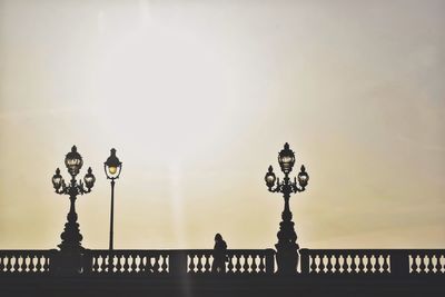 Low angle view of silhouette statue against sky during sunset