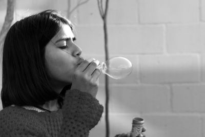 Girl blowing bubbles 