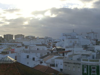 High angle view of buildings in city against sky