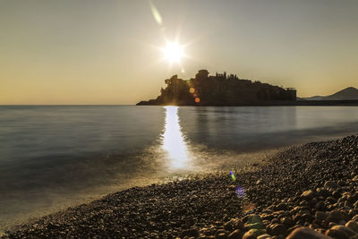 Scenic view of sea against sky during sunset