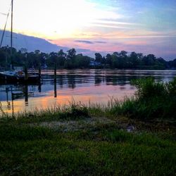 Scenic view of lake at sunset