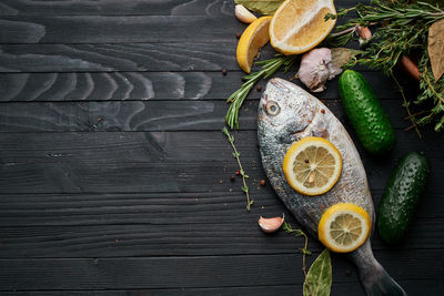 Directly above shot of fruits and leaves on table