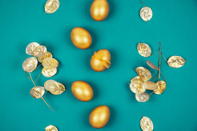 High angle view of candies against blue background