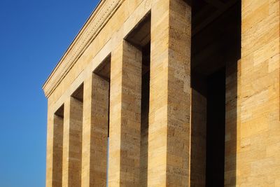 Low angle view of building against blue sky