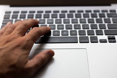 Close-up of hand using mobile phone