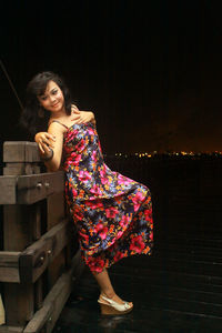 Portrait of smiling young woman standing outdoors