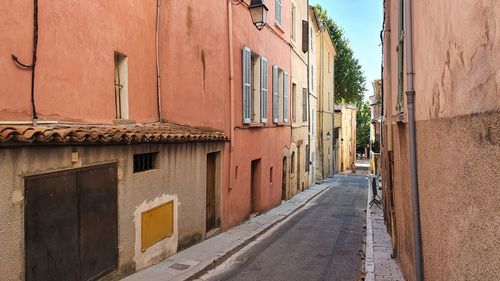 Street amidst buildings against sky