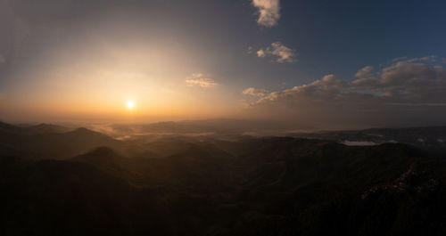 Scenic view of mountains against sky during sunset