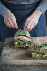 Midsection of man preparing food