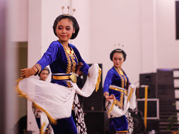 Portrait of young woman on stage