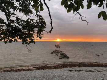 Scenic view of sea against sky at sunset