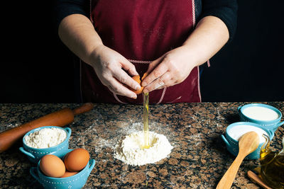 Midsection of person preparing food