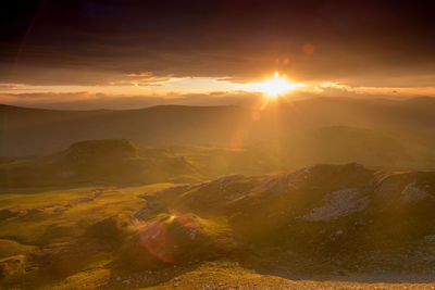 Scenic view of landscape against sky during sunset