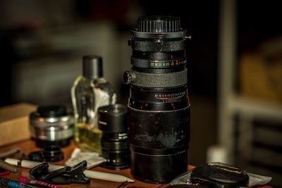 Close-up of camera lenses on table