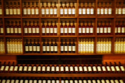 Full frame shot of bottles in shelf