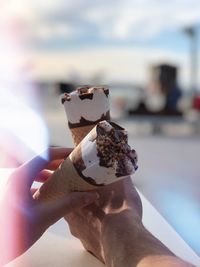 Close-up of hand holding ice cream cone