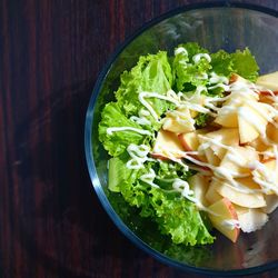 Directly above shot of chopped vegetables in bowl on table