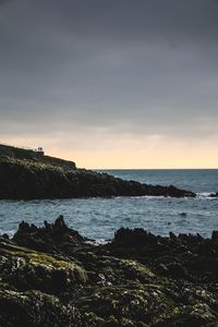 Scenic view of sea against sky at sunset