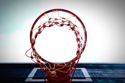 Low angle view of basketball hoop against sky