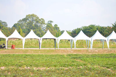 Built structure on field against sky