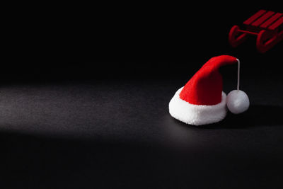 Close-up of ball on table against black background