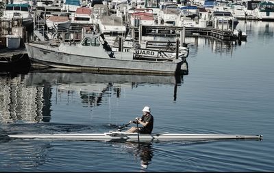 Boats moored at harbor