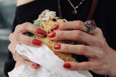 Midsection of woman holding food