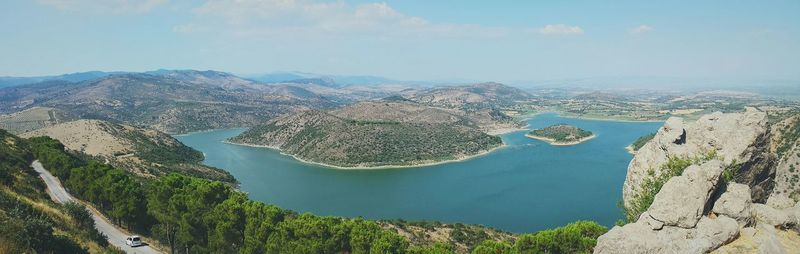 High angle view of lake amidst mountains against sky