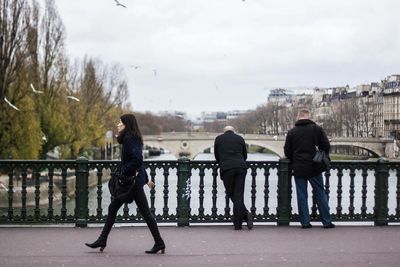 Full length of woman standing against sky