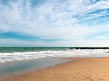 Scenic view of beach against sky