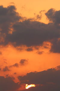 Low angle view of dramatic sky during sunset