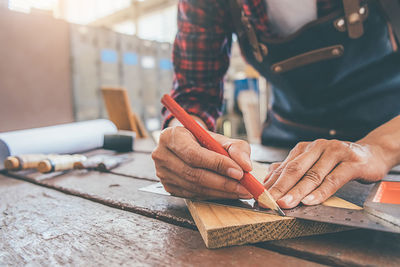 Close-up of man working on table