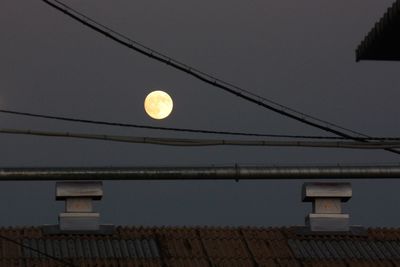 Low angle view of illuminated street light at night