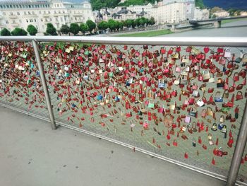 High angle view of padlocks on railing