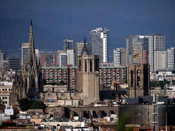 High angle view of buildings in city against sky