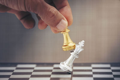 Close-up of human hand against the background