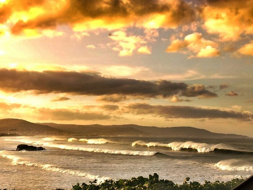 sunset, water, sky, sea, mountain, scenics, beauty in nature, cloud - sky, tranquil scene, tranquility, beach, orange color, nature, shore, idyllic, cloudy, mountain range, cloud, coastline, outdoors