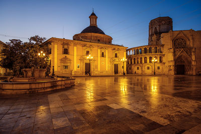 Illuminated building against sky at dusk. valencia, spain