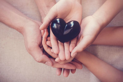 Close-up of woman hand holding heart shape