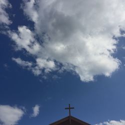 Low angle view of telephone pole against sky