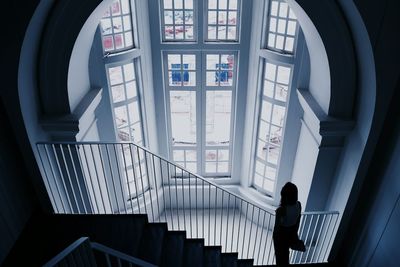 Silhouette woman on against windows